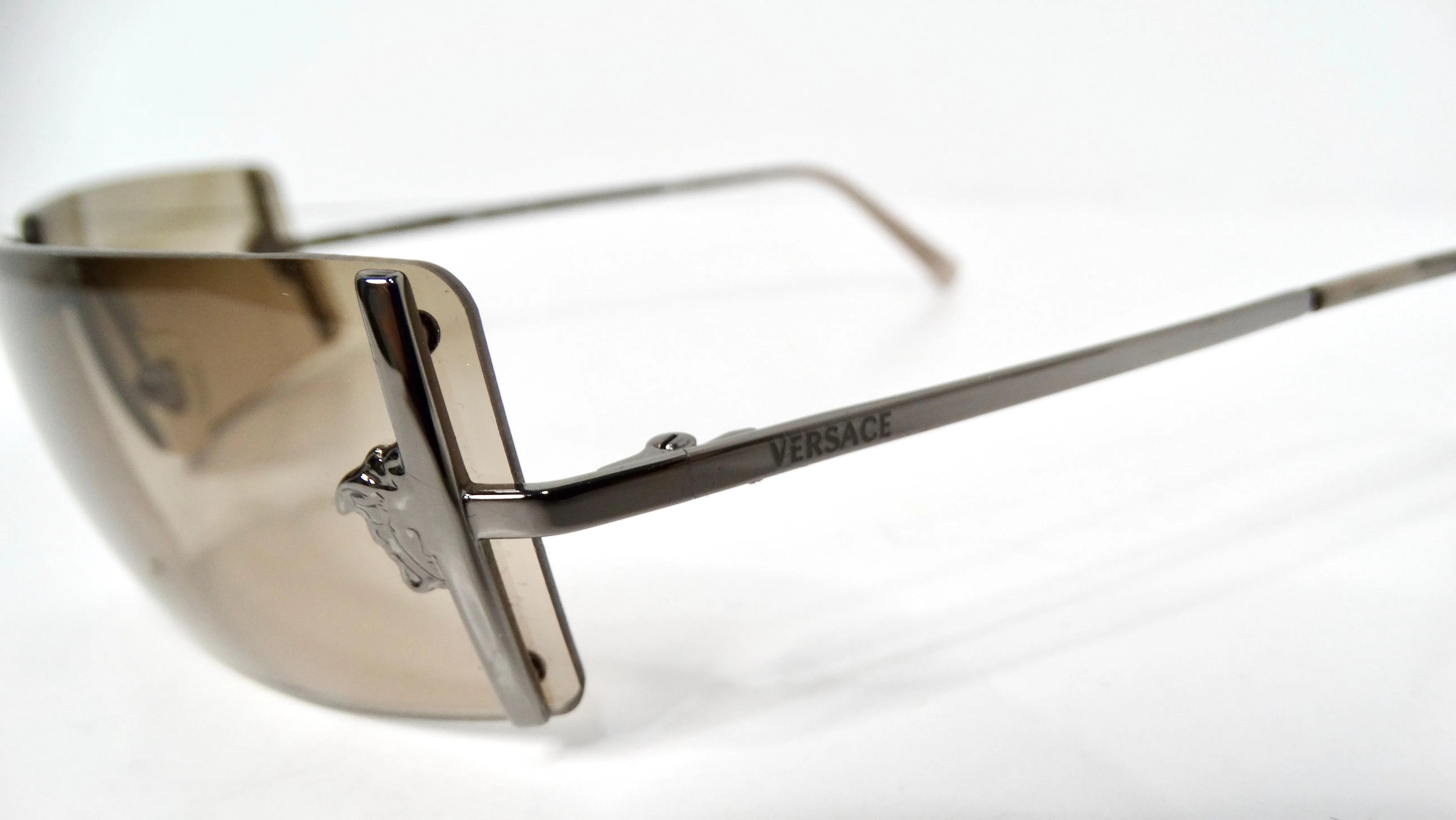 1990s Versace Medusa Brown Tinted Rectangular Rimless Shield Metal Sunglasses