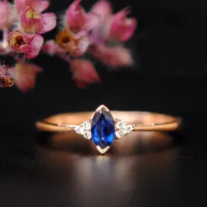 Blue Sapphire Marquise and Diamond Cluster Ring
