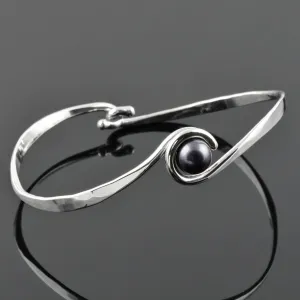 Silver "Curl" Bangle with Black Freshwater Pearl, by Tom Kruskal